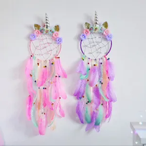 Handmade unicorn dream catcher wall hanging with colorful feathers for cute kids room decor