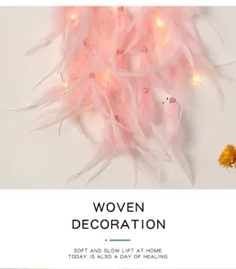 Pink feather dream catcher detail, LED light hanging decor for bedroom warmth and cozy room.