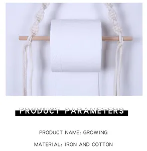 Detailed view of handmade wooden and cotton macrame toilet paper holder, natural style.