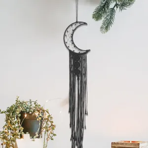 Black crescent moon macrame wall hanging dream catcher for modern home bedroom decor.