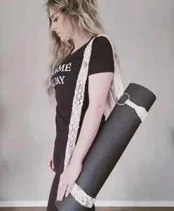 Handmade macrame cotton yoga mat strap, elegant boho style carrier sling for fitness.