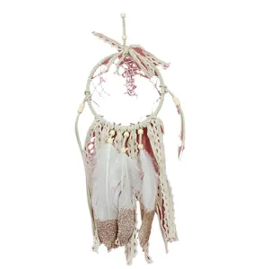 Handmade girlish pink dream catcher hanging ornament with lace and feathers for room decor.