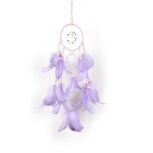 Beautiful purple dream catcher wall hanging decor with feathers and beads for bedroom.