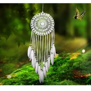 Handmade white dream catcher with feathers and beads, beautiful wall hanging decor for home.