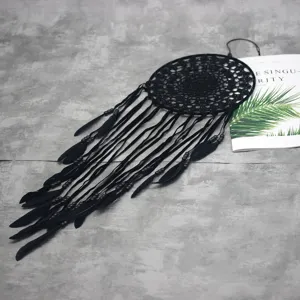 Handmade black dream catcher with feathers and beads, stylish wall hanging for home decor.