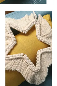 Handmade woven star wall hanging with fringe minimalist decor for cozy home interior design