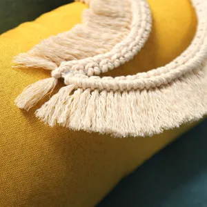 Handmade woven macrame moon fringe hanging ornament for modern minimalist wall home decor.