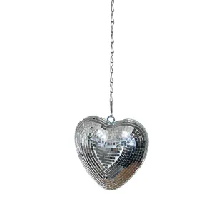 Close-up detail of the heart-shaped disco mirror ball with sparkling reflection and chain.