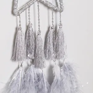 Silver dream catcher hanging ornament with tassels and feathers for bedroom home decor.