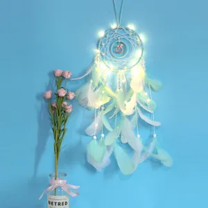 Double ring carousel dream catcher with LED lights and feathers for bedroom wall decor.