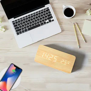Minimalist wooden LED digital alarm clock with temperature display for modern home office decor.