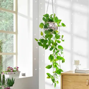 Close-up detail shot of the hanging disco ball planter with mirror finish and green leaves.
