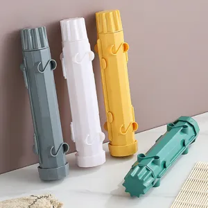 Detail close-up view of multi-color plastic sushi mold and bazooka kit for home kitchen DIY.