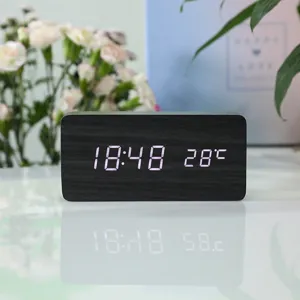 Modern wooden digital LED alarm clock with time and temperature display for home desktop decor.