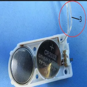 Detail view of the LED string light battery box with CR2032 coin cell and transparent wire