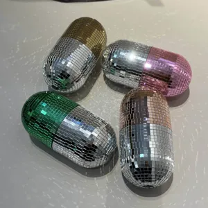 Detailed view of creative disco mirror capsule storage boxes with shimmering mosaic tiles.