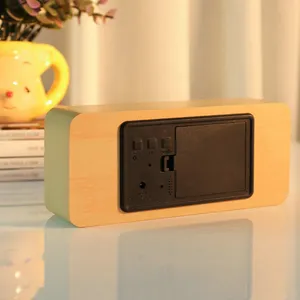 Wooden LED digital alarm clock with time display, sound control and temperature function.