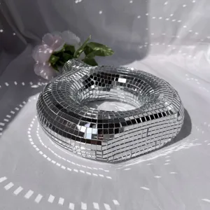 Disco mirror donut vase detail, reflective mosaic glass decor for stylish room decor.