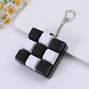 Mechanische Tastatur Tastenkappe Fidget Spielzeug Schlüsselanhänger, schwarz-weiße 9-Tasten.