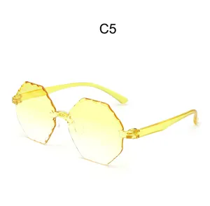 Gafas de sol poligonales sin montura de gelatina amarilla, tendencia de verano elegante.