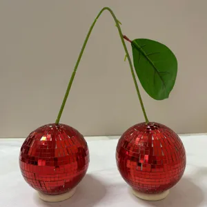 Red mirror disco ball cherry ornament detail view, shiny mosaic glass decor for desktop.