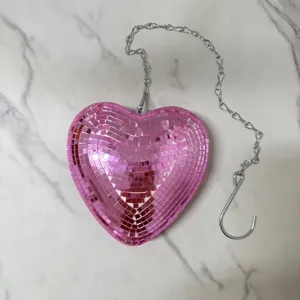 Pink heart disco ball mirror hanging decoration with silver chain for party room decor.