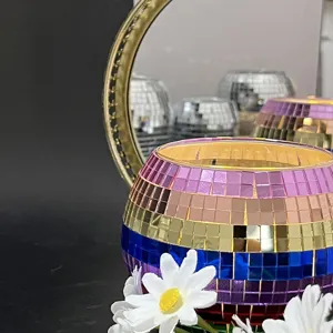 Close-up detail of colorful disco mosaic glass candle holder with multi-color stripes.