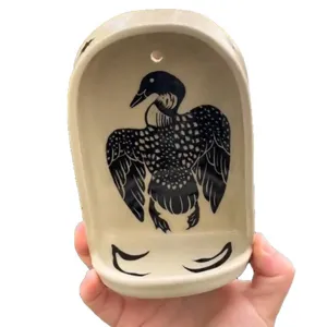 Resin wall niche altar pocket with black and white loon bird motif decorative craft.
