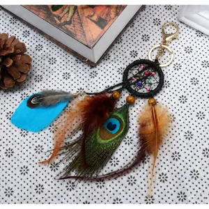 Llavero atrapasueños de plumas de pavo real natural para llaves de coche y decoración de bolsos.