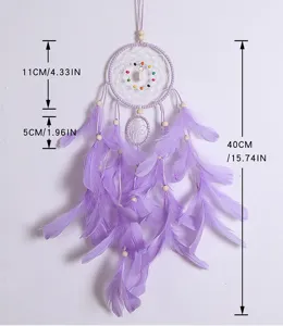 Purple feather dream catcher wall hanging decor with wooden beads and woven web design.
