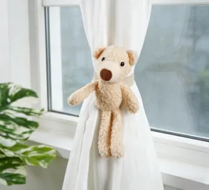 Cute plush bear curtain tieback detail shot, perfect for children room and home decor.