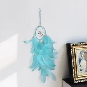 Blue feather dream catcher wall hanging decor with beads, perfect for bedroom and home art.