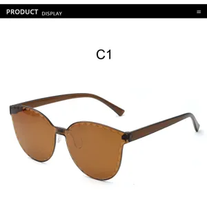 Scalloped edge brown gradient frameless sunglasses detail view, clear oceanic lens design.