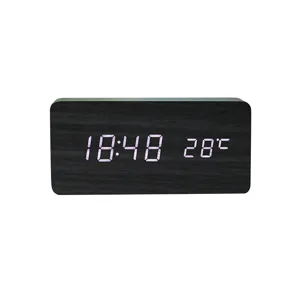 Minimalist LED wooden digital alarm clock with temperature display for modern home decor.