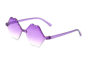 Close-up detail of purple rimless gradient sunglasses featuring unique scalloped edges.
