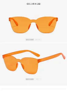 Orange transparent frameless one-piece sunglasses detail view, stylish eyewear for adults.