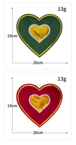 Detailed view of large heart shaped sequin embroidery patch with velvet fabric details.