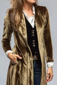 Vintage velvet long trench coat detail shot, elegant women outerwear fashion style.