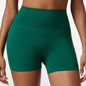 Dark green high-waisted yoga shorts, athletic fitness running biker shorts detail shot.