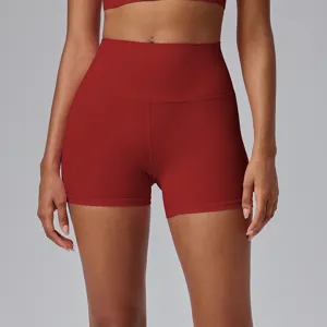 High-waisted red athletic yoga shorts, form-fitting design for gym, running, and pilates training.