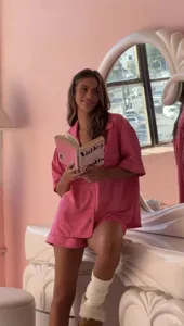 Pink satin pajama set for women, featuring short sleeve top and shorts for stylish loungewear.