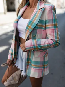 Detailed view of women's colorful plaid lapel blazer jacket, stylish pattern and button accent.