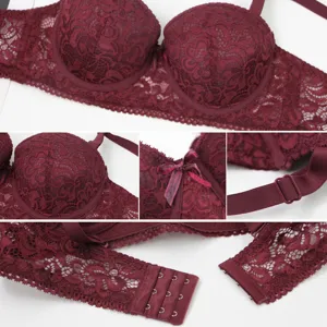 Wine red lace bra detail shot, elegant floral pattern, underwired support and adjustable strap.