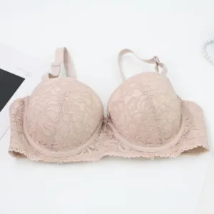 Detailed view of the elegant pink lace push-up bra featuring delicate floral patterns and straps.