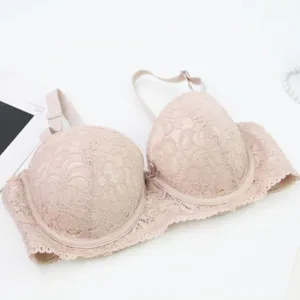 Detail view of a beige lace push-up bra with underwire, offering great support and elegant style.