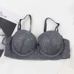 Gray lace push-up bra detail view, showing elegant floral lace texture and underwire support.