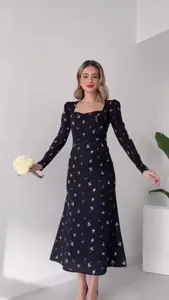 Elegant black floral midi dress with square neckline and long sleeves for women.