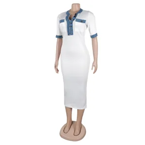 Detail view of the women's V-neck dress, showcasing the stylish denim patchwork and short sleeves.
