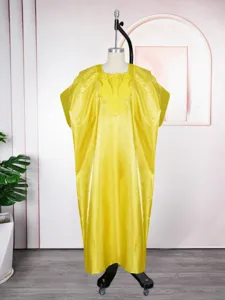 Detail view of the yellow satin caftan featuring exquisite square collar embroidery work.