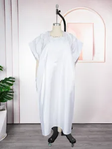 Detailed view of the white satin loose kaftan dress with exquisite chest embroidery features.